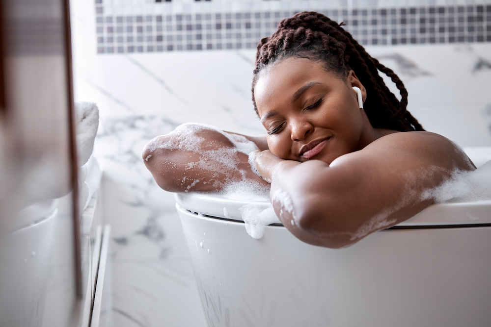 black woman with full figure enjoying self care time