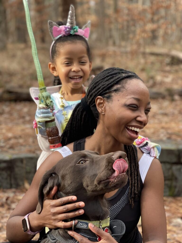 Yoga teacher Erica Rascon and her daughter at the park with their dog.